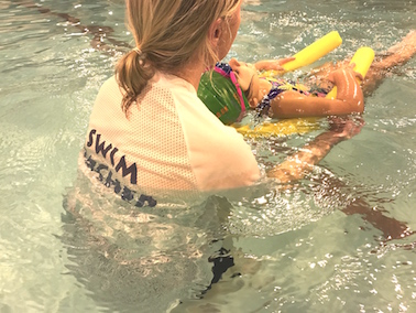 A swimming teacher at Blue Wave Swim School