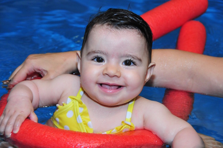 Teaching babies and toddlers how to swim at Blue Wave Swim School