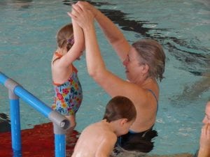 Lena Andersson Stenquist teaching toddler to swim