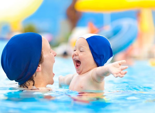 a mother and a toddler in a swim lesson